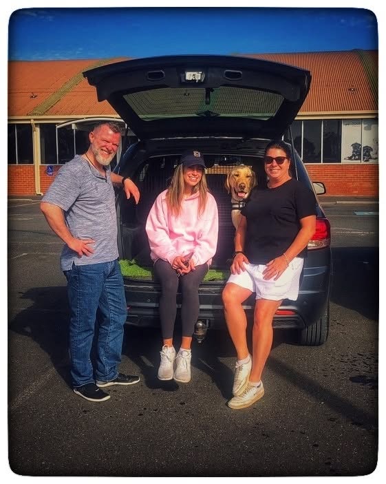 Trainers and a yellow Labrador working from a car boot during a Glasgow session